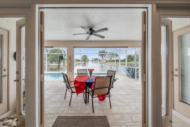 1512 SW 4th Ct, Cape Coral, FL 33991 - view of patio / terrace with a ceiling fan, a water view, an outdoor pool, and a lanai
