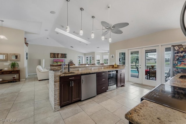 kitchen with dishwasher, lofted ceiling, decorative light fixtures, ceiling fan, and dark brown cabinets