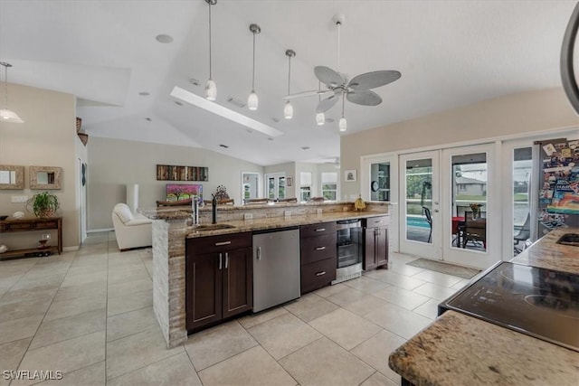 1512 SW 4th Ct, Cape Coral, FL 33991 - kitchen with beverage cooler, lofted ceiling, open floor plan, french doors, and light tile patterned floors