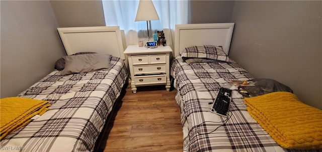 bedroom featuring hardwood / wood-style floors