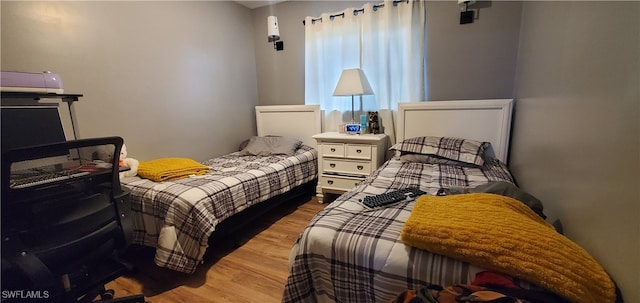 bedroom with light hardwood / wood-style flooring