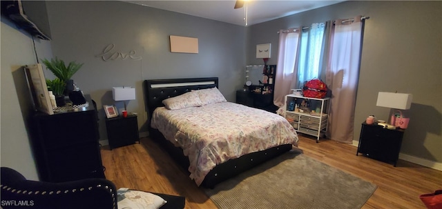 bedroom featuring ceiling fan and light wood-type flooring