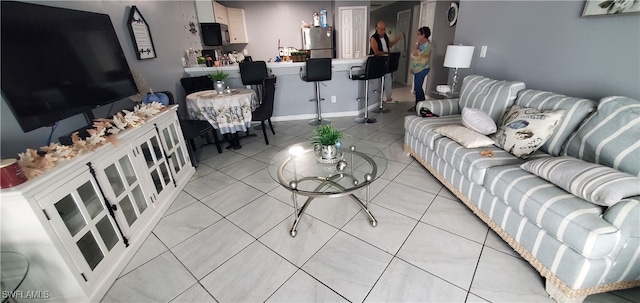 living room featuring light tile patterned flooring