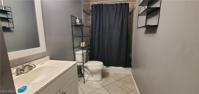 bathroom with vanity, tile patterned floors, and toilet