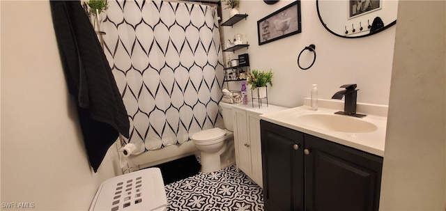 bathroom featuring toilet, vanity, and tile patterned floors