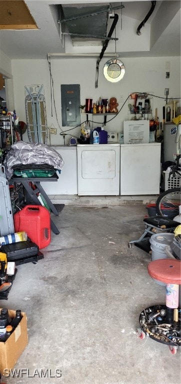 garage with electric panel and independent washer and dryer