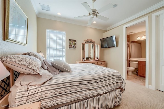 bedroom featuring ensuite bathroom, ceiling fan, ornamental molding, and light carpet