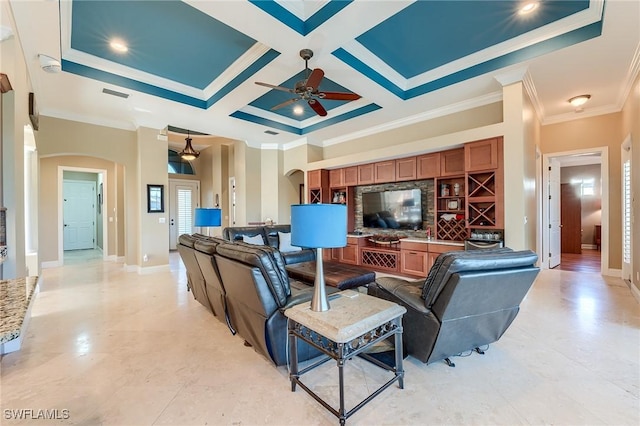 living room with beam ceiling, crown molding, ceiling fan, and coffered ceiling