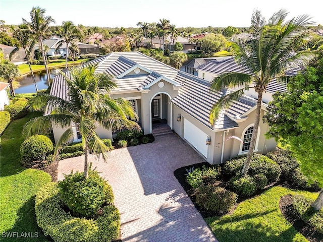 birds eye view of property with a water view