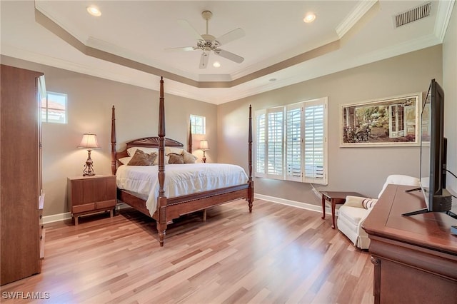 bedroom featuring light hardwood / wood-style floors, multiple windows, crown molding, and ceiling fan