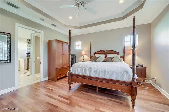 bedroom featuring light hardwood / wood-style floors and multiple windows