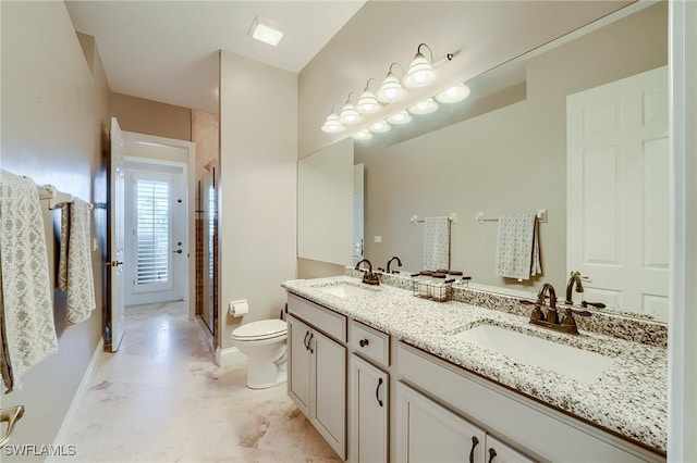 bathroom featuring vanity, toilet, and walk in shower