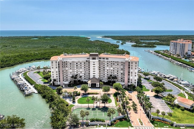 birds eye view of property with a water view