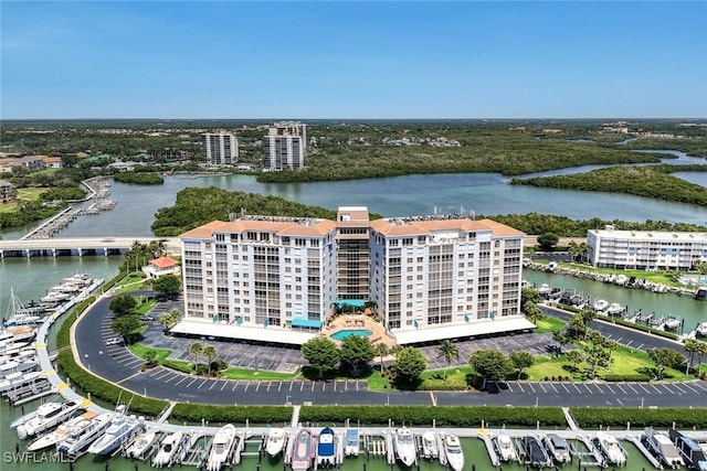 birds eye view of property with a water view