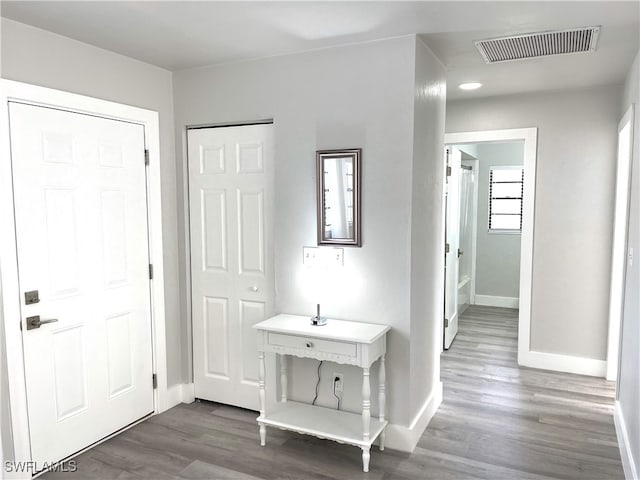 foyer entrance with dark hardwood / wood-style flooring