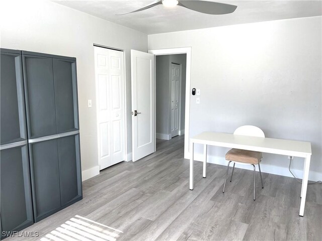 office area featuring light hardwood / wood-style flooring and ceiling fan