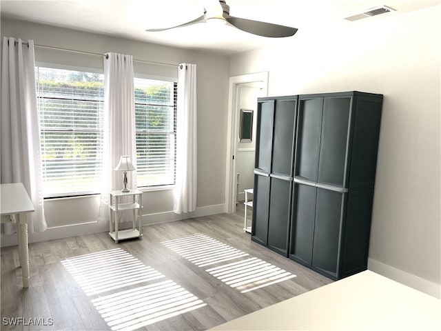 bedroom featuring light hardwood / wood-style flooring and ceiling fan