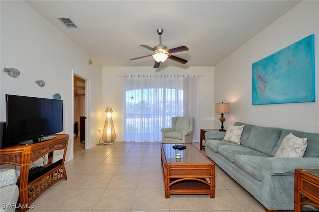 tiled living room featuring ceiling fan