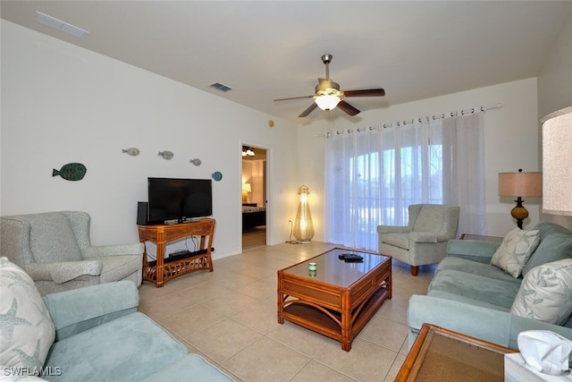 tiled living room with ceiling fan