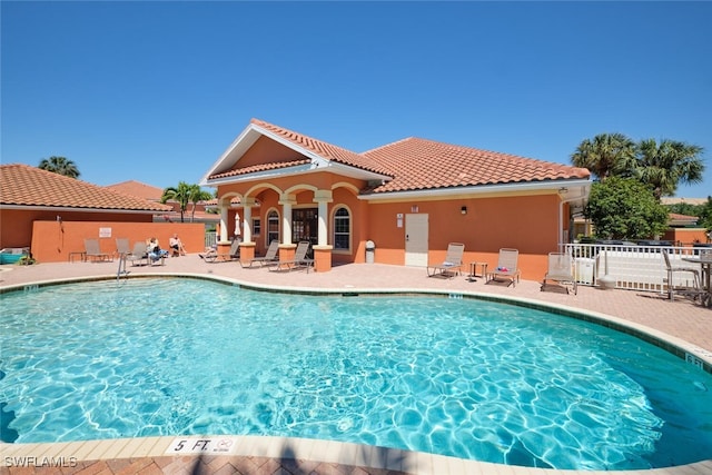 view of swimming pool featuring a patio