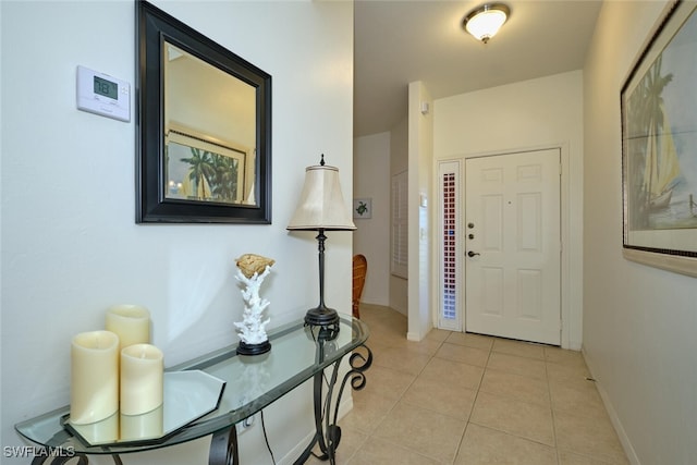 foyer featuring light tile patterned floors