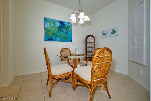 dining room featuring a notable chandelier and light tile patterned floors