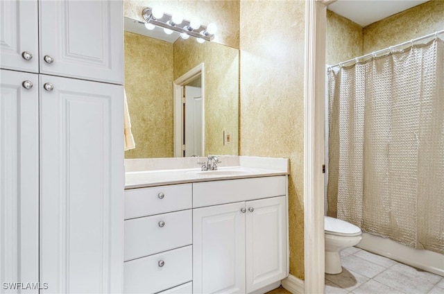 bathroom featuring toilet, walk in shower, vanity, and tile patterned floors