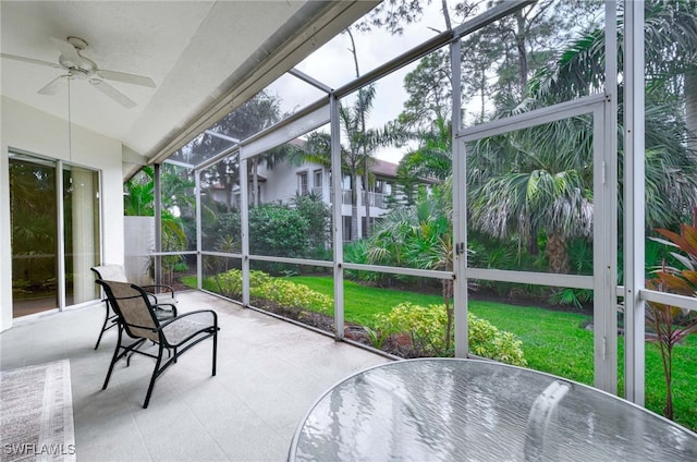 sunroom featuring ceiling fan