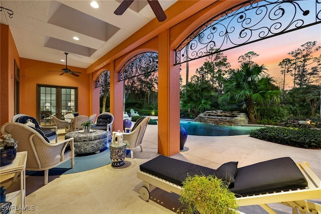 patio terrace at dusk with ceiling fan