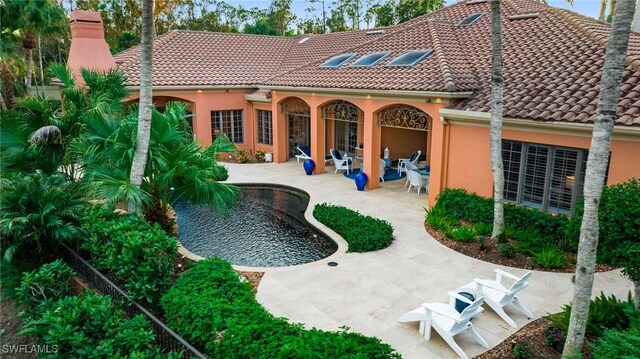 rear view of property with a patio area