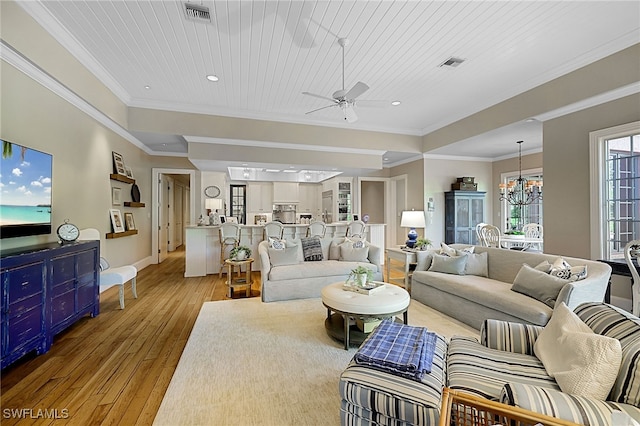 living room with ceiling fan with notable chandelier, light hardwood / wood-style floors, crown molding, and wooden ceiling