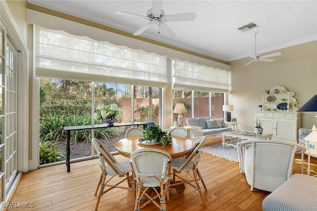 sunroom featuring wooden ceiling and ceiling fan