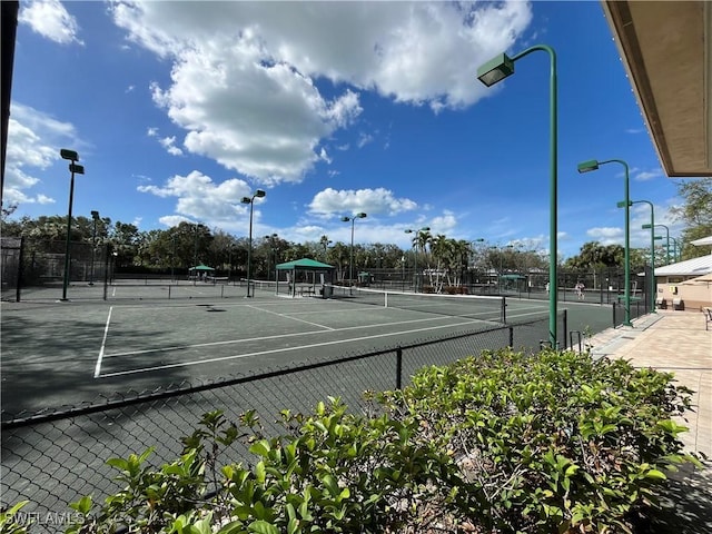 871 Tanbark Dr Unit 101, Naples, FL 34108 - view of tennis court with fence