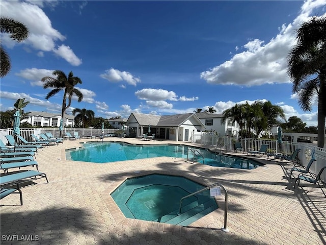871 Tanbark Dr Unit 101, Naples, FL 34108 - community pool featuring a hot tub, fence, and a patio area
