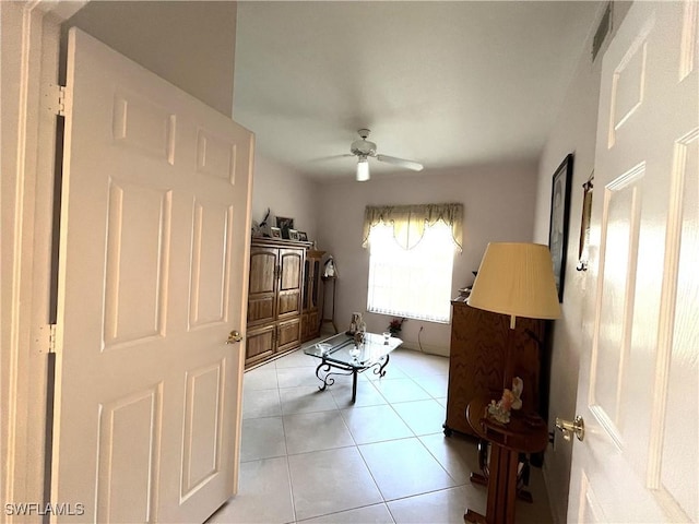 871 Tanbark Dr Unit 101, Naples, FL 34108 - living room with ceiling fan and light tile patterned flooring