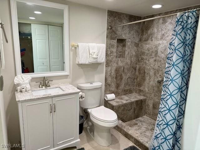 bathroom featuring a shower with curtain, vanity, and toilet