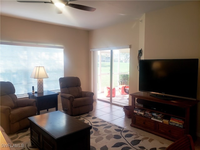 living room featuring ceiling fan and light tile patterned flooring