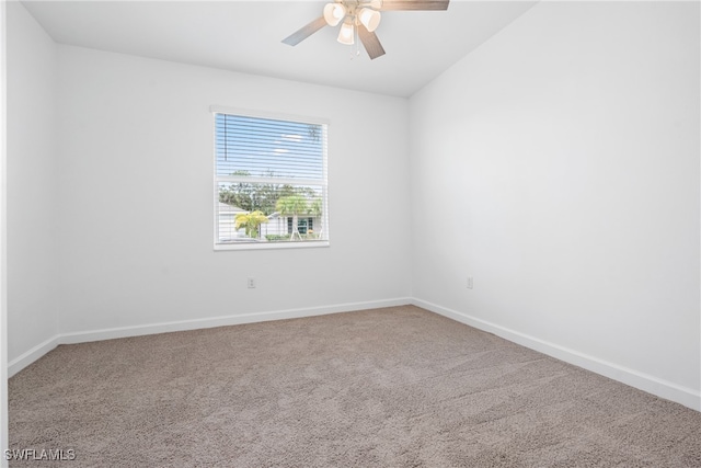 unfurnished room with carpet flooring, lofted ceiling, and ceiling fan