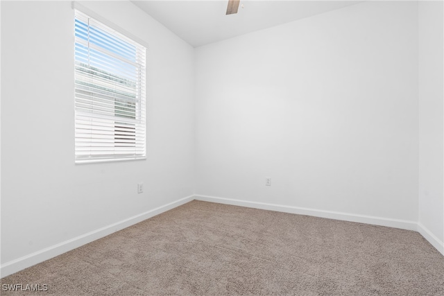 spare room featuring carpet flooring and ceiling fan