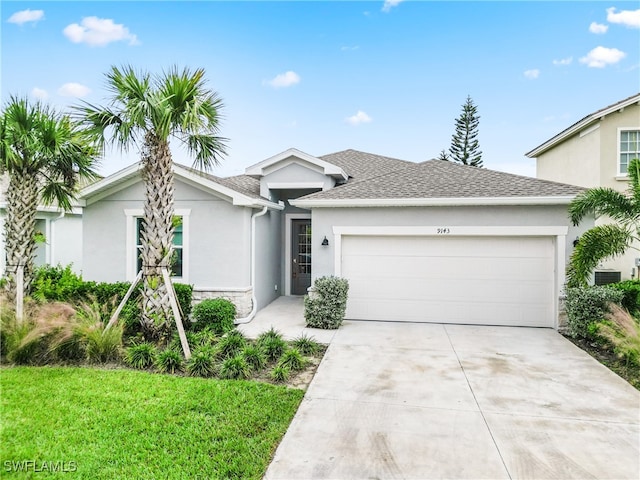 single story home with a garage and a front yard