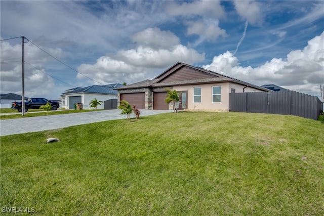 single story home with a garage and a front yard