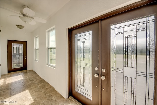 doorway with french doors and ceiling fan