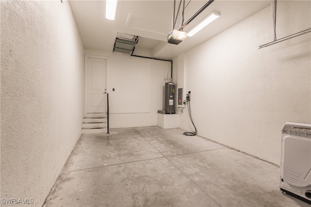 garage featuring heating unit, a garage door opener, and water heater