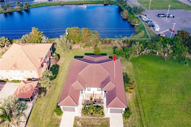 birds eye view of property featuring a water view