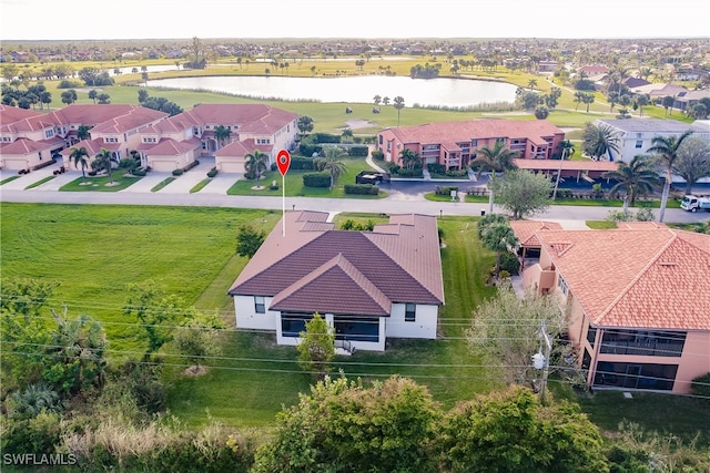 drone / aerial view with a water view