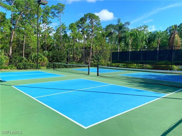 view of sport court with basketball hoop