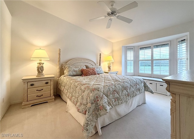 bedroom featuring light carpet and ceiling fan