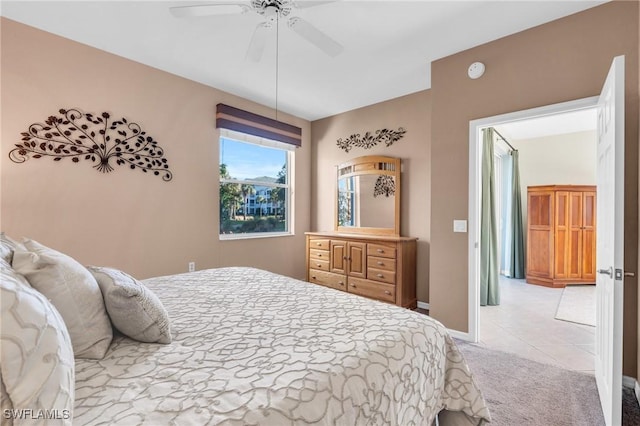 3970 Loblolly Bay Dr Unit 5-108, Naples, FL 34114 - carpeted bedroom featuring a ceiling fan, tile patterned floors, and baseboards