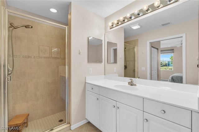 3970 Loblolly Bay Dr Unit 5-108, Naples, FL 34114 - ensuite bathroom featuring a stall shower, vanity, and tile patterned floors