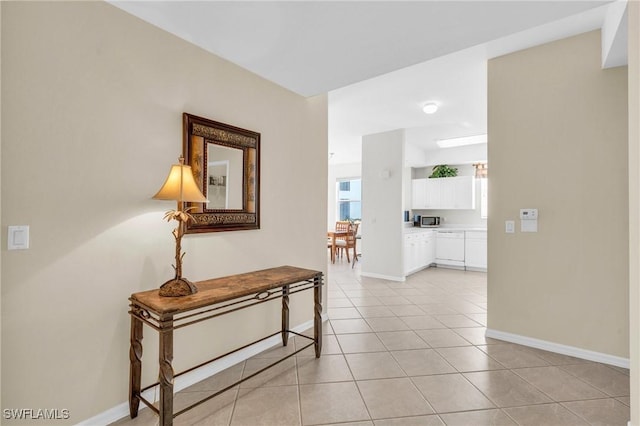3970 Loblolly Bay Dr Unit 5-108, Naples, FL 34114 - hallway with light tile patterned flooring and baseboards